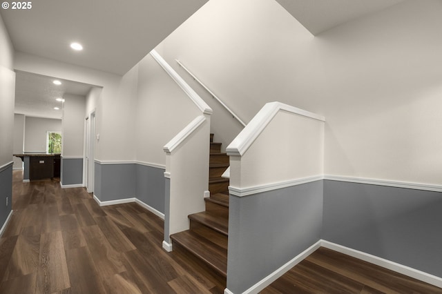 stairs with recessed lighting, baseboards, and wood finished floors