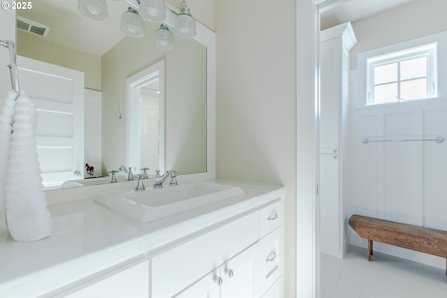 bathroom featuring visible vents, tile patterned flooring, and vanity