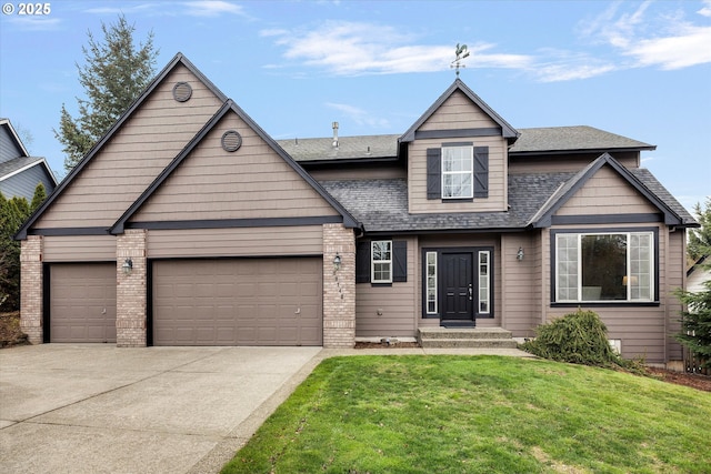 view of front of house with a garage and a front yard