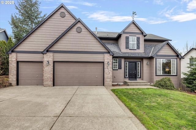 view of front of home with a garage and a front yard