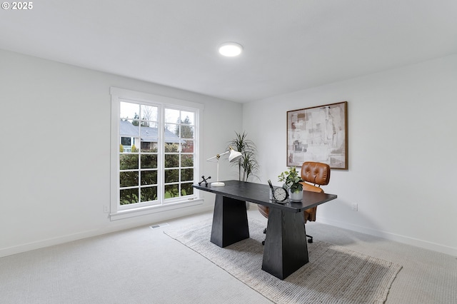 carpeted home office featuring baseboards and visible vents