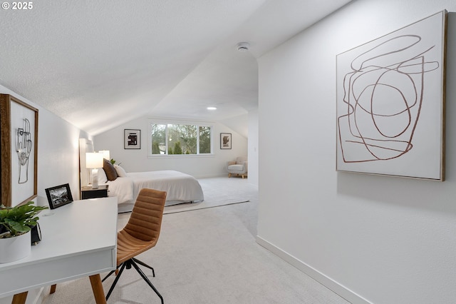 carpeted bedroom with lofted ceiling, baseboards, and a textured ceiling