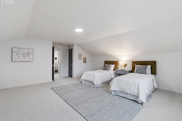 bedroom with baseboards, lofted ceiling, and light carpet