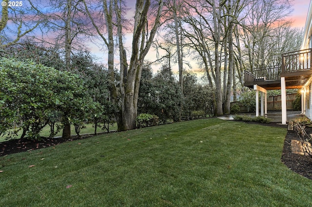 view of yard featuring a patio area and a wooden deck