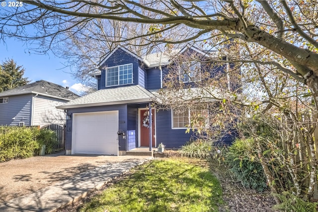 traditional home featuring roof with shingles, concrete driveway, and an attached garage