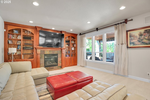 9459 SE Tarnahan Dr, Happy Valley, OR 97086 - living room with baseboards, recessed lighting, a tiled fireplace, light carpet, and a textured ceiling
