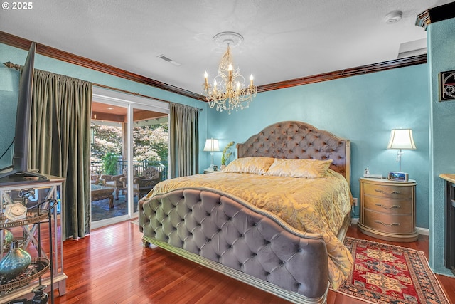 9459 SE Tarnahan Dr, Happy Valley, OR 97086 - bedroom with access to exterior, wood finished floors, crown molding, a chandelier, and a textured ceiling