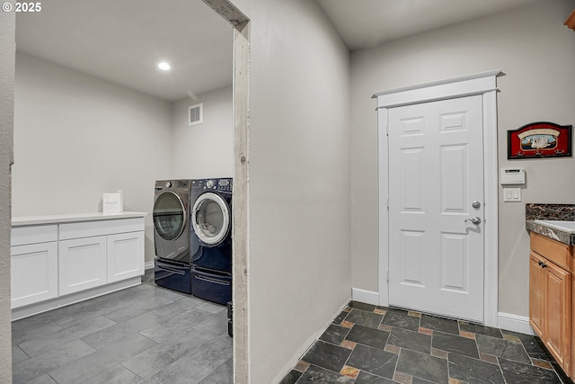9459 SE Tarnahan Dr, Happy Valley, OR 97086 - washroom with washing machine and dryer, cabinet space, and baseboards