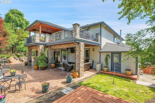 9459 SE Tarnahan Dr, Happy Valley, OR 97086 - rear view of property with a balcony, a patio, a deck, a lawn, and roof with shingles