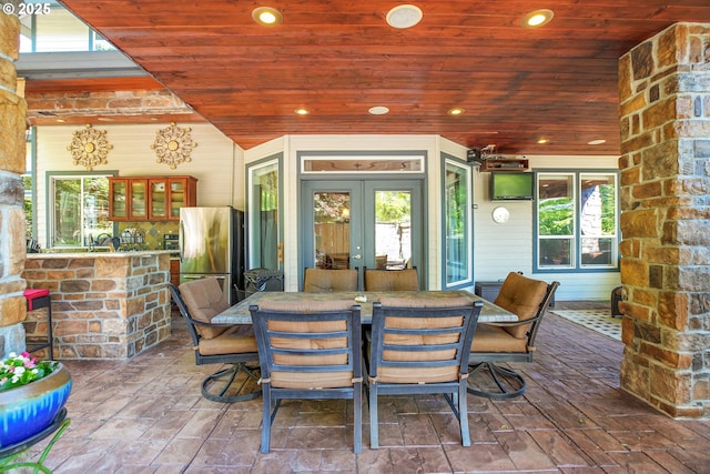 9459 SE Tarnahan Dr, Happy Valley, OR 97086 - view of patio featuring french doors, outdoor dining space, and a sink