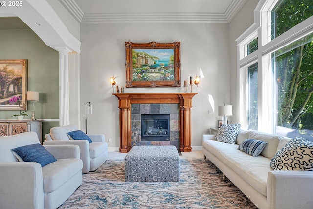 9459 SE Tarnahan Dr, Happy Valley, OR 97086 - living room featuring a tiled fireplace, ornamental molding, and ornate columns