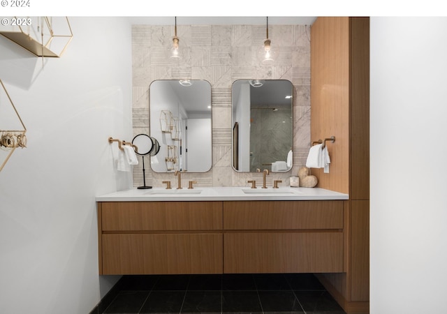 bathroom featuring tile patterned floors, decorative backsplash, double vanity, and a sink