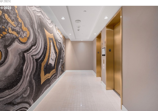 corridor with light tile patterned floors, baseboards, elevator, and recessed lighting