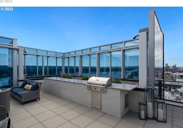 view of patio / terrace with exterior kitchen, area for grilling, and an outdoor hangout area