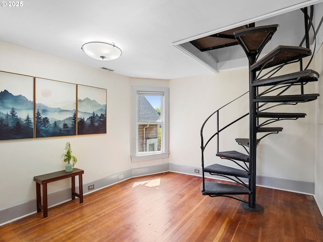 131 NE Tillamook St, Portland, OR 97212 - stairway featuring hardwood / wood-style floors and baseboards