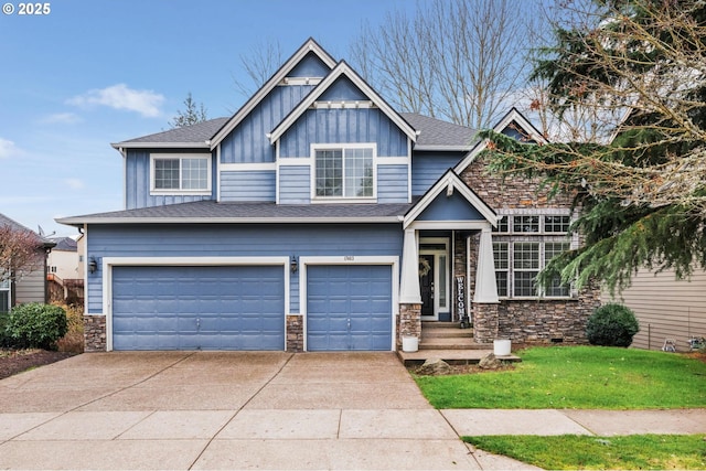 craftsman-style house with a garage and a front lawn