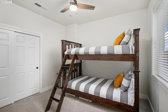 bedroom featuring carpet flooring, ceiling fan, and a closet