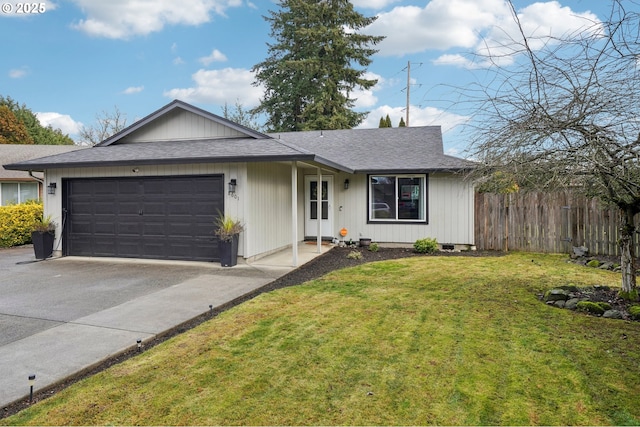 ranch-style house featuring a garage and a front lawn