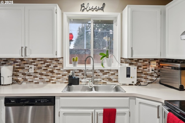 kitchen with stainless steel dishwasher, sink, decorative backsplash, and white cabinets