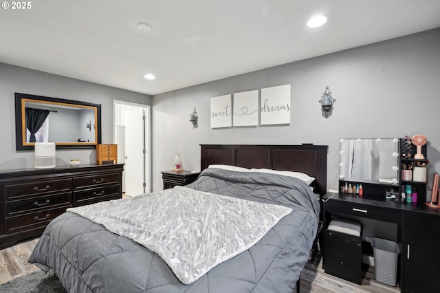 bedroom with light hardwood / wood-style floors