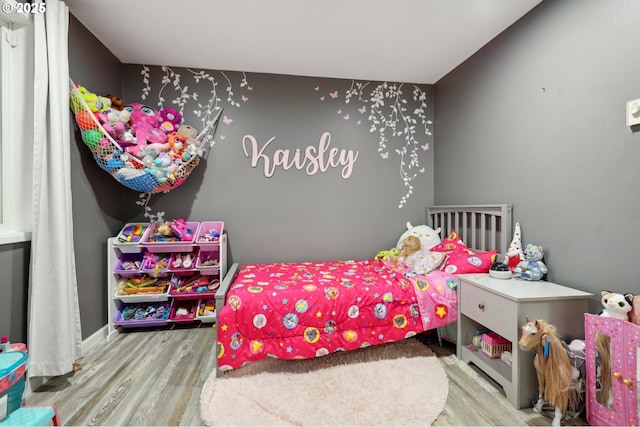 bedroom featuring hardwood / wood-style flooring