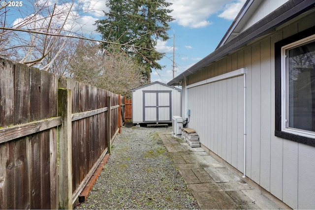 view of yard with a storage shed and ac unit