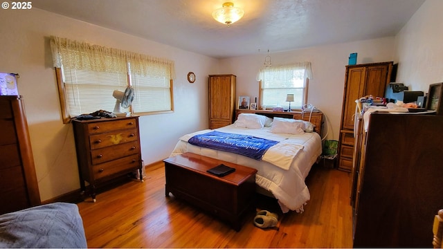 bedroom with light wood-style flooring