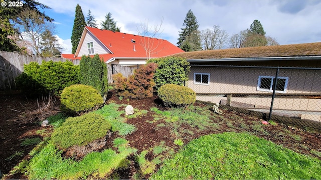 view of home's exterior featuring fence