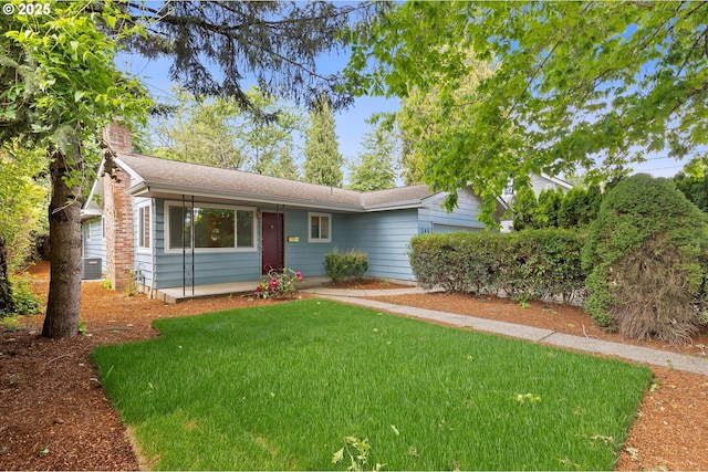 245 NE 4th Ave, Hillsboro, OR 97124 - ranch-style house with a front yard and a chimney