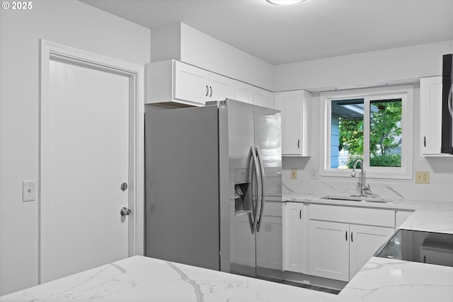 245 NE 4th Ave, Hillsboro, OR 97124 - kitchen with stainless steel fridge with ice dispenser, light stone counters, a sink, white cabinets, and range