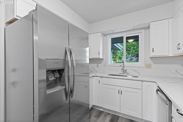 245 NE 4th Ave, Hillsboro, OR 97124 - kitchen with stainless steel appliances, a sink, white cabinetry, light stone countertops, and dark wood finished floors