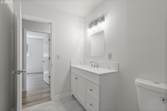 245 NE 4th Ave, Hillsboro, OR 97124 - half bath with vanity, toilet, and baseboards