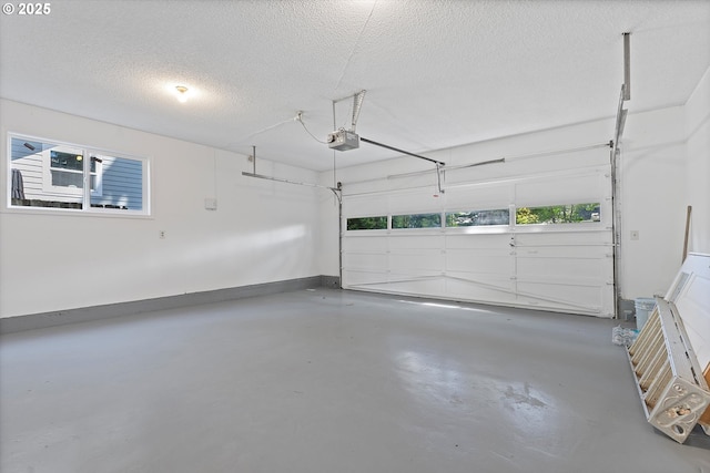245 NE 4th Ave, Hillsboro, OR 97124 - garage with a garage door opener and baseboards