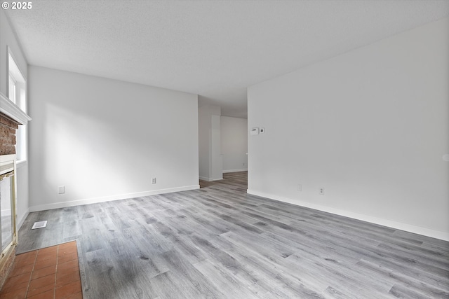 245 NE 4th Ave, Hillsboro, OR 97124 - unfurnished living room with wood finished floors and baseboards