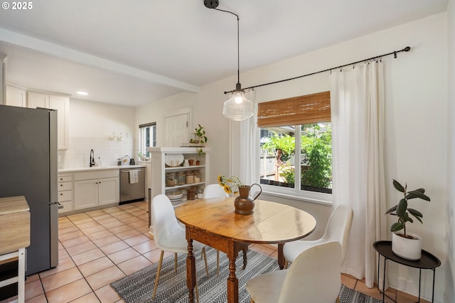 909 NE Brazee St Unit 16, Portland, OR 97212 - dining room featuring light tile patterned floors and recessed lighting