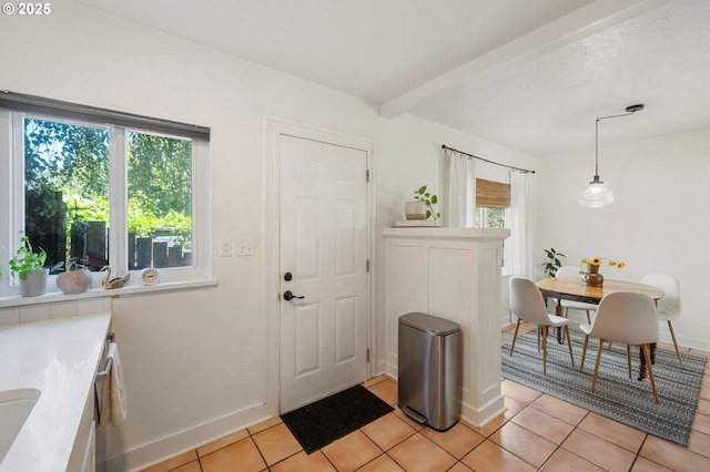 909 NE Brazee St Unit 16, Portland, OR 97212 - foyer featuring light tile patterned floors and baseboards