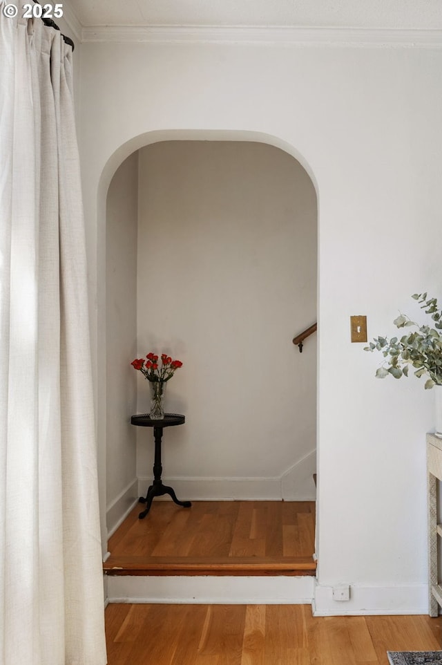 909 NE Brazee St Unit 16, Portland, OR 97212 - hall with arched walkways, wood finished floors, and ornamental molding
