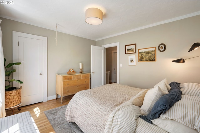 909 NE Brazee St Unit 16, Portland, OR 97212 - bedroom with ornamental molding and light wood-style flooring