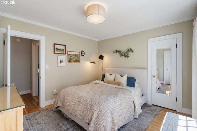 909 NE Brazee St Unit 16, Portland, OR 97212 - bedroom with wood finished floors and crown molding