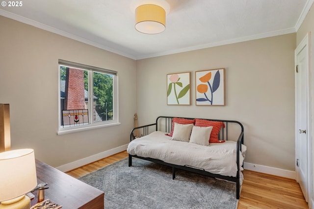 909 NE Brazee St Unit 16, Portland, OR 97212 - bedroom featuring ornamental molding and wood finished floors