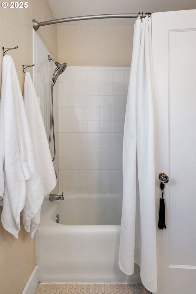 909 NE Brazee St Unit 16, Portland, OR 97212 - bathroom featuring shower / bath combo with shower curtain and tile patterned floors