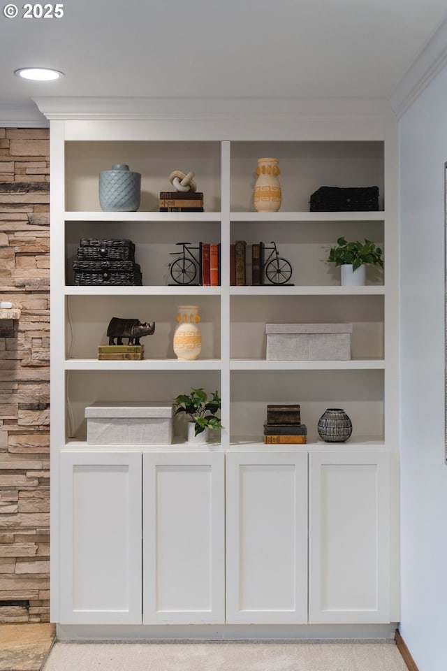 interior space with white cabinets and light colored carpet