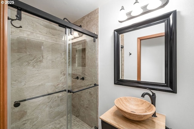 bathroom with vanity and an enclosed shower