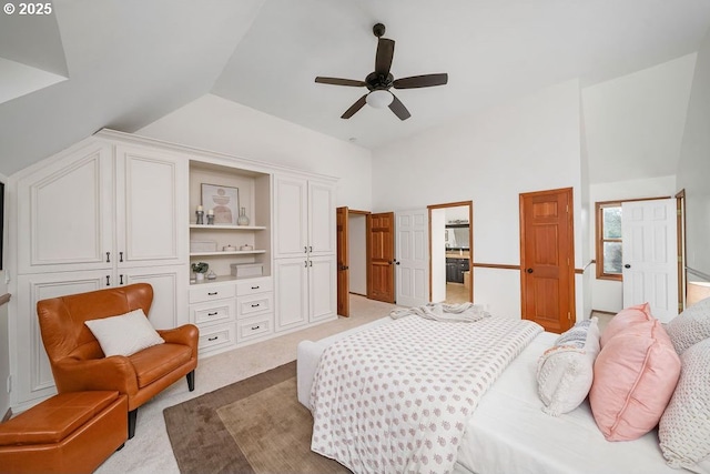 bedroom with light colored carpet, ceiling fan, and lofted ceiling