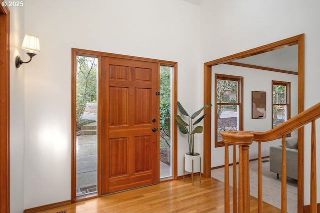 entryway with plenty of natural light and light hardwood / wood-style flooring