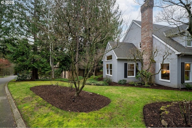 view of property exterior featuring a yard