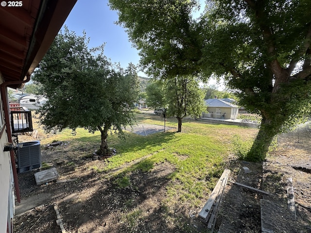 212 NW Bridge St, John Day, OR 97845 - view of green lawn featuring central air condition unit