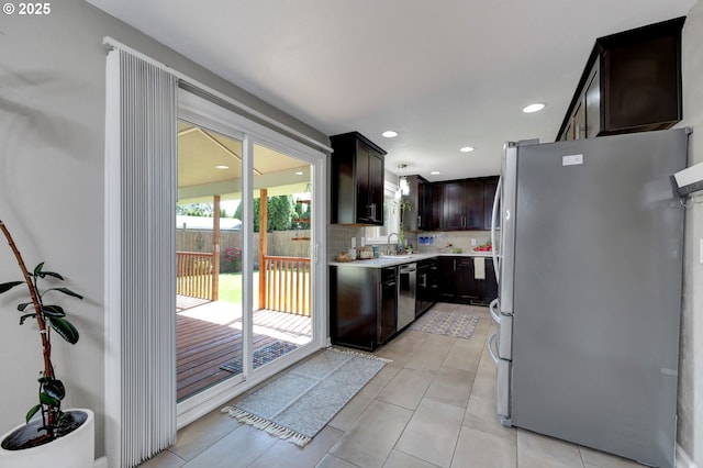 1364 Goodpasture Island Rd, Eugene, OR 97401 - kitchen featuring stainless steel appliances, light countertops, a sink, tasteful backsplash, and light tile patterned floors