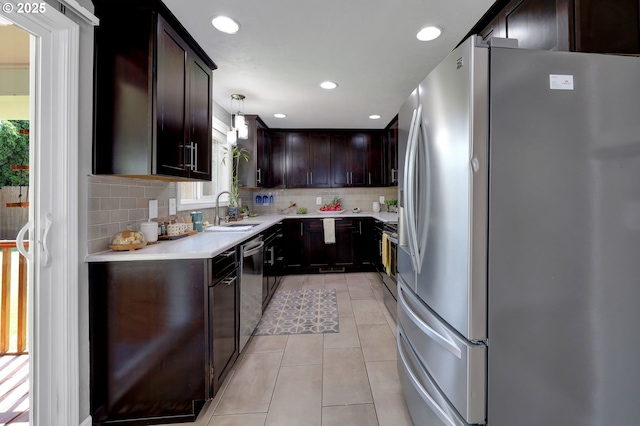 1364 Goodpasture Island Rd, Eugene, OR 97401 - kitchen with stainless steel appliances, a sink, backsplash, dark brown cabinets, and light tile patterned flooring