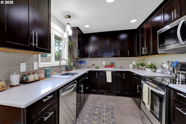 1364 Goodpasture Island Rd, Eugene, OR 97401 - kitchen featuring stainless steel appliances, a sink, tasteful backsplash, light tile patterned floors, and recessed lighting